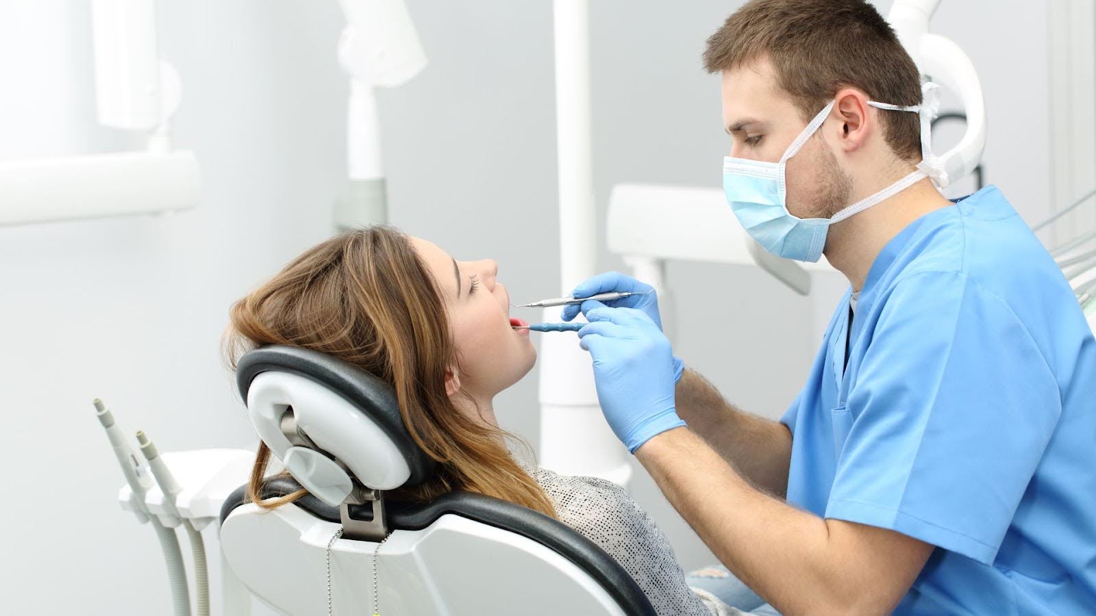 Dentist in Redmond WA performing a dental checkup on a young girl patient